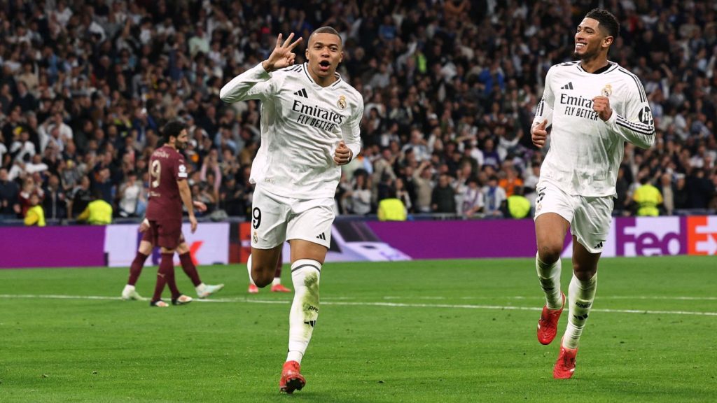 Kylian Mbappe scored a hat-trick, celebrating with Jude Bellingham in the match between Real Madrid vs Manchester City - UEFA Champions League draw