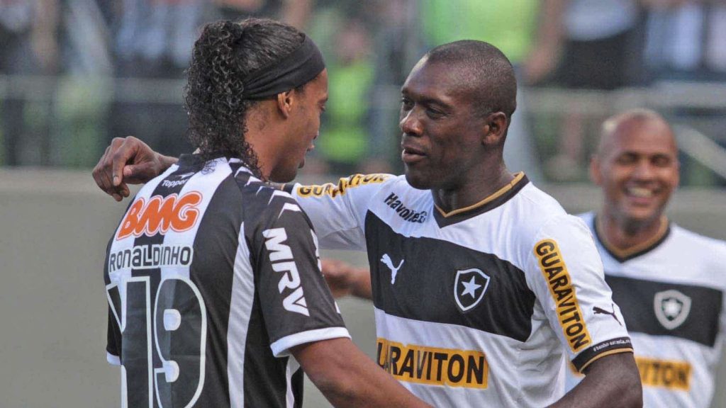 Clarence Seedorf and Ronaldinho shared a embrace on the pitch.